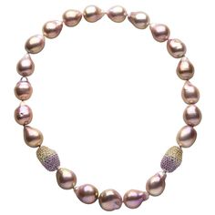 This mesmeric necklace by Yoko London features sumptuous pink baroque pearls in rare sizes. Each baroque pearl is completely unique and this design perfectly highlights their allure and mystique. The rich, pink hues of the pearls are perfectly offset by the pink and yellow sapphire clasps, which add a striking finish to this already unique piece. This show-stopping necklace will be the centre of attention whenever it is worn, second only to the woman who wears it. - 14-18.5mm Freshwater Baroque Beautiful Wedding Jewelry, Funky Necklace, 1st Dibs, Dainty Diamond Necklace, Vintage Beads Necklace, Baroque Pearl Necklace, Gold Bead Necklace, Yoko London, Pearl Necklaces