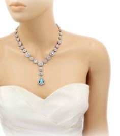 This bridal necklace and earrings set features exquisite Top quality 23mm Swarovski Light Turquoise Teardrop Crystal, brilliant Cubic zirconia, platinum plated components and rhinestones. and pear cut pendant 3 inches backdrop. Sparkling 23mm Swarovski Light Turquoise Teardrop Crystal and daisy rhinestones elegantly dangle from ear posts. The zirconia are set in rhodium plate surrounding rhinestones. This gorgeous jewelry set will look elegant and beautiful quality on any classic or vintage insp Blue Hand Set Bridal Necklace For Wedding, Elegant Turquoise Jewelry Sets For Wedding, Elegant Turquoise Wedding Jewelry Sets, Hand Set Teardrop Bridal Necklace, Elegant Turquoise Bridal Necklace For Wedding, Turquoise Jeweled Wedding Jewelry, Turquoise Wedding Jewelry With Jewels, Turquoise Teardrop Wedding Jewelry, Blue Wedding Necklace