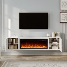 an entertainment center with a fireplace and television mounted on it's wall in a living room