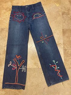 "Vintage 70s Denim Jeans - Awesome Embroidered Designs - Sun, Tree, Snake LOVE ROCKS VINTAGE ITEM DETAILS & DESCRIPTION . Amazing Embroidered Designs - Sun, Snake, Tree . Zip & Button Fly . Belt Loops Label: N/a - appear handmade Size: no size - Refer to measurements - Vintage size tends to run smaller. NO RETURNS FOR NOT FITTING! Era: est. 1970s Color: Blue Denim - refer to Photographs Material: Cotton Denim Condition: - True Vintage - Very Good - previously owned - expect vintage wear Tree Snake, 70s Jeans, Hippy Festival, 70s Denim, Vintage Denim Jeans, 70s Boho, Love Rocks, Hippie Festival, Vintage Love