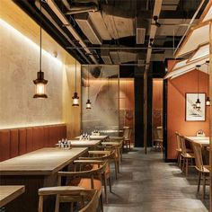 an empty restaurant with wooden tables and chairs