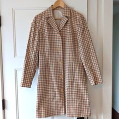 Extremely Cute Plaid Light Coat Perfect For Spring And Fall. Feels Like A Trench Coat. No Tags, Might Be Handmade From The 60s/70s But It Is Professionally Made And In Excellent Unworn Condition. Will Work Best For Sizes Xs Or S. Model Is A Small/Size 6. Vintage, Mod, Mid Mod, Tartan, Plaid, Anthropologie, Free People, Sezane, H&M, Madewell, Everlane, Chore Coat, Jacket, Long Coat, Trench Coat, Retro, Car Coat, J Crew, Jcrew, Mango, Zara, Coatigan, Raincoat, Rain Coat, Montgomery Ward, House Coa Retro Long Coat For Workwear, Tailored Retro Outerwear For Office, Retro Cotton Blazer For Fall, Retro Outerwear With Pockets For Office, Retro Single Breasted Outerwear For Work, Retro Notch Lapel Outerwear For Fall, Vintage Plaid Outerwear For Spring, Retro Spring Workwear Outerwear, Vintage Spring Outerwear For Office