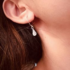 These unique teardrop moonstone dangle drop earrings feature minimalist design of a tiny teardrop moonstone on textured 925 sterling silver ear wires. Add these minimalist teardrop moonstone earrings to your everyday fine jewelry collection or as gift for you loved one. The tiny moonstone dimensions: 4.3 x 7.5 mmMaterials: 925 sterling silver, moonstone Jewelry Care: See more information about how to care for your jewelry here. Shipping Policy: Orders will be shipped within 1-3 business days. Economy shipping will take 7-14 days to arrive and standard shipping is 1- 4 days for U.S. orders. International shipping time is depended on the country and per shipping method. Shipping cost will be calculated at check out.For more details, see our Shipping Policy. Return Policy: Free return within Dainty Silver Teardrop Earrings As Gift, Dainty Sterling Silver Teardrop Earrings Nickel Free, Delicate Silver Teardrop Earrings, Dainty Hypoallergenic Teardrop Earrings, Dainty Silver Dangle Teardrop Earrings, Dainty Sterling Silver Teardrop Earrings For Everyday, Delicate Teardrop Earrings, Delicate Hammered Teardrop Jewelry, Dainty Hammered Teardrop Jewelry