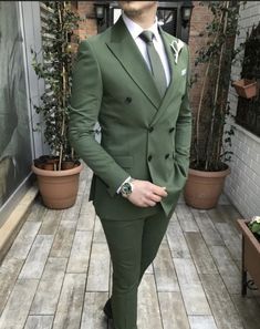 This is a Classic Two-Piece Suit Green color Double Breasted coat from high quality fabric and imported materials. Our products are handcrafted by experienced tailors who make sure the that the stitching is precise, lining is proper, and the overall product is sturdy enough to not go out of shape for more than a few years. Also, all our products available more colors and designs in this collection. Include. Coat Pant   Fabric. Terry Rayon premium  This is a 2-piece set of a Coat and a trouser. W Green Long Sleeve Suit For Groom, Green Long Sleeve Tuxedo For Wedding, Green Tuxedo Suit For Wedding, Green Single Breasted Suit For Party, Green Three-piece Wedding Suit, Tailored Green Winter Suit, Green Single Breasted Blazer For Groom, Green Notch Lapel Suit For Winter, Fitted Three-piece Suit For Groom