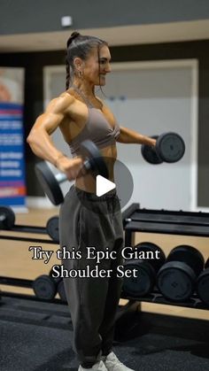 a woman standing in front of a row of dumbbells with the words try this epic giant shoulder shoulder set