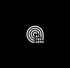 a black and white logo with the word at the core in it's center