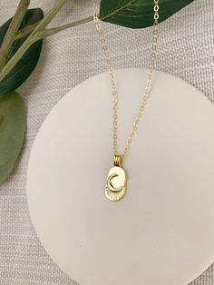 LA LUNA MOON NECKLACE This 14K Gold Filled moon necklace is a minimal statement piece. The moon medallion has a vintage feel. Gold filled is hypoallergenic, and water & tarnish resistant. △ 21x10mm Gold Filled Moon tag pendant △ 14K Gold Filled Chain △ Dainty 14K Gold Filled lobster clasp closure △ Choose your length See more Minimal Charm Necklaces here!: https://etsy.me/3sqYLeQ Photos of dainty jewelry are taken close up to show detail. Please review measurements before purchase. I may hav Everyday Gold Crescent Charm Necklace, Gold Charm Necklace With Moon Phase, Gold Half Moon Charm Necklace With Moon Phase, Gold Crescent Charm Necklace With Delicate Chain, Gold Crescent Charm Necklace With Clavicle Chain, Gold Plated Crescent Charm Necklaces, Gold Crescent Clavicle Chain Charm Necklace, Gold Half Moon Charm Necklace, Gold-plated Crescent Charm Necklaces