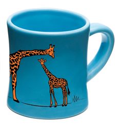 two giraffes are standing next to each other on a blue coffee mug