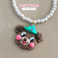 Party Bear Pendant Necklace made from Clay Handmade and painted Necklace : plastic pearl 14inch + 7 cm. ✅Handmade The product may not be 100% the same as in the picture. There may be some differences. But the product patterns are similar. We use 7-14 days before shipping because it take time to make Cute Handmade Plastic Necklace, White Plastic Necklace As A Gift, White Plastic Necklace As Gift, White Plastic Necklace For Gift, Plastic Round Beads Necklace For Gift, White Kawaii Necklace For Parties, Necklace Clay, Painted Necklace, Hand Painted Pendant