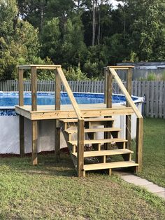 an above ground pool with steps leading up to it