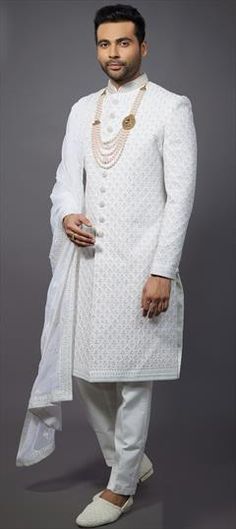 Wedding Sherwani: Buy Indian men’s sherwani | IndianWeddingSaree Luxury White Sherwani With Pearl Embroidery, Luxury Chikankari Embroidered Sherwani For Puja, White Cutdana Bandhgala For Formal Occasions, White Cutdana Bandhgala For Formal Events, Formal White Sherwani With Cutdana, White Sherwani With Cutdana For Formal Occasions, White Kurta With Cutdana For Reception, White Cutdana Kurta For Reception, Bollywood Style Bandhgala With Pearl Embroidery For Wedding