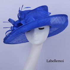 Large brim sinamay hat with one side up brim,feather flower &sinamay leaves Brim width:13cm Head size: 56.5cm,also with elastic to adjust it to be smaller,please check head size carefully before ordering it Ideal for wedding/party/races/church It is handmade product and every hat is well inspected before shipment,no return accepted.But please do contact us if you have any problems on your order.Thanks for your supports. Spring Party Straw Hat In Sinamay, Blue Sinamay Party Fascinator, Blue Sinamay Fascinator For Party, Fitted Sinamay Boater Hat For Party, Summer Party Hat With Feather Trim, Wide Brim Fascinator With Feather Trim For Party, Party Style Sinamay Straw Hat With Short Brim, Party Boater Hat In Sinamay, Sinamay Straw Hat With Curved Brim For Party