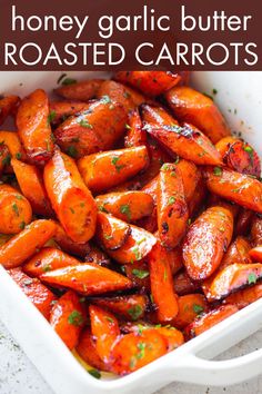 honey garlic butter roasted carrots in a white casserole dish with text overlay