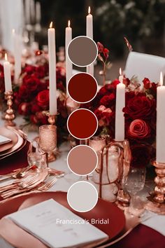 the table is set with candles, plates and napkins in shades of brown, red, white and pink