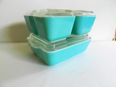 three plastic containers stacked on top of each other