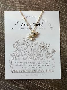 a card with a necklace on it that says, i am missing jesus christ the son