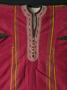 "Traditional Turkmen Koynek & Dress. It is made out of hand loomed silk and cotton fabrics used under armpits and skirt. Designs is silk embroidery. It has been used and both arms have stains ( 4.7\" x 4.7\" - 12 cm x 12 cm) and also stain on the skirt (5.9\" x 2.3\" - 15 cm x 6 cm). Backside small tear like 1.5\" - 4 cm and another stain about 2.7\" - 7 cm Size: Arms spread out 56.2\" - 143 cm, Armpit 24.8\" - 63 cm Height 51.5\" - 131 cm, skirt 31.4\" - 80 cm. Free Express Shipping." Traditional Embroidered Cotton Silk Kaftan, Traditional Silk Tunic Kaftan, Transitional Red Raw Silk Dress, Traditional Cotton Silk Tunic Kurta, Embroidered Silk Tunic Kurta, Red Raw Silk Dress, Fitted Kurta With Woven Motifs For Transitional Season, Cotton Kurta With Woven Motifs For Traditional Ceremonies, Traditional Cotton Silk Dresses For Summer