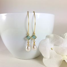 "Pearl Earrings, Gold Pearl Earrings, Pearl Dangle Earrings, Pearl Drop Earrings, Aquamarine Earrings, Aqua Pearl Earrings, Wedding Bridal Earrings, Bridesmaid Gift, Pearl Jewelry Stunning combination, these earrings are composed of a gold plated faceted aqua glass connector with a 14x8mm faux teardrop pearl dangling beneath and simply hung from long gold tone copper ear wires. Can be made in a short version if desired. Dangle length is 2-1/4\" (58mm) from the top of ear wire. Discount for multi French Hook Pearl Drop Earrings For Wedding, Drop Pearl Earrings With French Hook For Wedding, Wedding Pearl Drop Earrings With French Hook, Dangle Earrings For Bridesmaid Gift, French Hook Dangle Jewelry For Wedding, French Hook Dangle Wedding Jewelry, Wedding Dangle Jewelry With French Hook, Earrings Gold Pearl, Pearl Earrings Gold