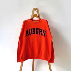 Vintage Auburn University crewneck sweatshirt/ L * PLEASE READ BEFORE PURCHASE * PLEASE consider the PHOTOS before making the decision * The images may DIFFER in appearance from the actual product because we took pictures under daylight.  * PLEASE send your PHONE NUMBER after your purchase for the shipping company to contact you X No returns X No refund Condition : 9/10 More details : look at the pictures  Brand : The cotton exchange  Size On Tag : L Pit to pit/ Chests : 24.5/49 inches  Length : 28 inches  Material : cotton polyester  Color : Orange  * Payment accept PayPal only * ALL ITEMS are VINTAGE which may show some signs of wear and tear * Due to the different display and different light, the picture may not reflect the actual color of the item Thank you RE/16/8/23 Collegiate Crew Sweatshirt For Fall, Collegiate Crew Neck Sweatshirt For Fall, Orange Letter Print Crew Neck Hoodie, Orange Crew Neck Sweatshirt For Streetwear, Orange Crew Neck Sweater With Ribbed Cuffs, Orange Ribbed Cuff Crew Neck Sweater, Orange Crew Neck Sweatshirt With Ribbed Cuffs, Orange Relaxed Fit Sweatshirt With Crew Neck, Orange Relaxed Fit Crew Neck Sweatshirt