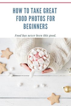 a person holding a bowl filled with marshmallows on top of a white table