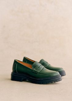 Minimalist loafers;Item made in our Portuguese atelier;Smooth leather exterior;Leather lining and insole;Rubber outsole;Heel height: 3 cm / 1.2 in;Platform height: 2 cm / 0.8 in Green Fashion Aesthetic, Shoe Rotation, Green Loafers, Lifestyle Dresses, Womens Loafers, Denim Suit, Platform Loafers, Swimwear Dress, Classic Bags