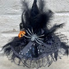 This black Witchy headpiece will take your Halloween outfit to the next level. It is an easy way to add a bit of spooky to you Halloween. *Locally hand made in New Orleans. Headpieces usually ship within 3-5 business days. Please be aware that due to the unique and handmade nature of each product, color, shapes, and sizes may vary slightly from the photo and descriptions. Halloween Novelty Mini Costume Hat, Handmade Costume Accessories For Halloween Masquerade, Novelty Costume Hats For Halloween Themed Events, Novelty Costume Hats And Headpieces For Halloween, Black Themed Costume Accessories For Masquerade, Themed Black Costume Accessories For Masquerade, Themed Black Costume Accessories For Carnival, Adjustable Black Mini Hats For Cosplay, Black Adjustable Punk Mini Hat