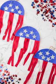 three paper plates with red, white and blue stars on them