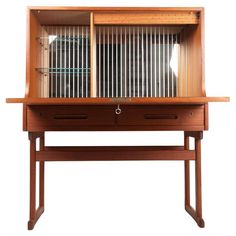 a wooden desk with a bird cage on top