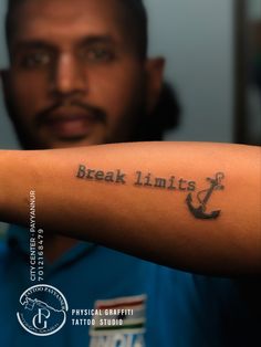 a man with a tattoo on his arm that says break limits and an anchor in the middle