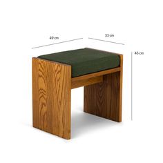 a wooden bench with a green cushion on the seat and measurements in front of it