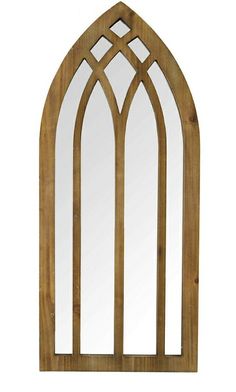 a wooden window frame with an arched design