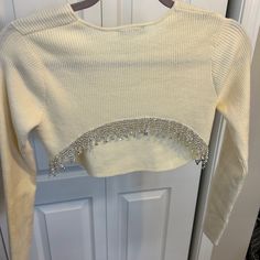 Elevate Your Wardrobe With This Stunning Beaded Crop Sweater From Zara. This Medium-Sized Sweater Is Perfect For Women Who Love To Keep Up With Fashion Trends. It Features Intricate Beading Accents That Add A Touch Of Glam To Any Outfit. This Sweater Is Perfect For Any Occasion, And Its Versatile Design Makes It A Must-Have For Any Fashion-Forward Woman. With Its Quality Material, You Can Expect Comfort And Durability That Will Last You For Years. Get Your Hands On This Beautiful Sweater Today A Fitted Tops With Rhinestone Fringe For Spring, Elegant Spring Top With Rhinestone Fringe, Spring Fitted Tops With Rhinestone Fringe, Fitted Spring Tops With Rhinestone Fringe, Elegant Fitted Tops With Rhinestone Fringe, Embellished Long Sleeve Crop Top For Night Out, Beaded Fitted Tops For Winter, Fitted Beaded Tops For Winter, Zara Fitted Tops With Rhinestones