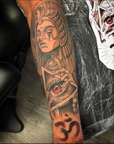 a person with a tattoo on their arm and an eye in the middle of his arm