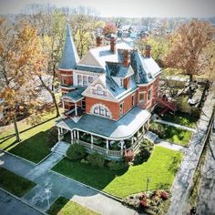 an aerial view of a large red brick house