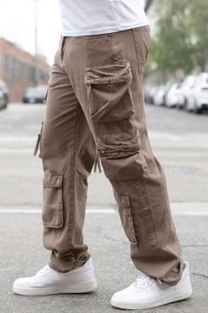 Elevate your casual wardrobe with our Baggy Fit Cargo Pants, designed to combine style, comfort, and functionality. Crafted with precision, these pants offer a relaxed fit and practical features for everyday wear.Key Features:Fabric: Made from 100% cotton, featuring a garment-washed finish for added softness and durability.Fit: Baggy fit for a relaxed and contemporary silhouette.Color Options: Available in taupe.Sizes: Offered in a range of waist and inseam sizes, including 30/30, 32/30, 34/30, Plus Size Mens Clothing, Cargo Pants Baggy, Fit Cargo Pants, Activewear Sets, Fleece Joggers, Cargo Pants Men, Baggy Fits, Casual Wardrobe, Bottoms Pants