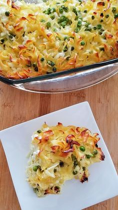 a casserole dish on a plate next to a serving dish