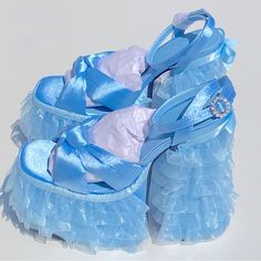 Sugar Thrillz Platform Layered Lace Satin Crystal Blue Sandals Heels Size 9 Feature A Satin Construction, A Ruffled Tulle Trim On The Platform Soles And Block Heels, A Bow Trim In The Back, Knotted Foot Uppers, And Rhinestone Buckle Closures. Details: Light Blue Man Made Materials 6" Heel 3" Platform Blue Sandals Heels, Dr Shoes, Fringe Sandals, Funky Shoes, Sugar Thrillz, Spring Sandals, Girly Shoes, Blue Heels, Crystal Blue