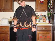 a person standing in a kitchen with flames all over their body and hands on his hips