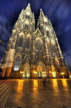 the large cathedral is lit up at night