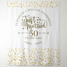 a white and gold wedding banner with the words just married 50 years ago printed on it