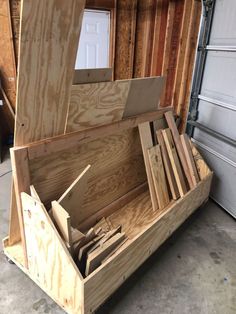 the inside of a storage box with wood in it