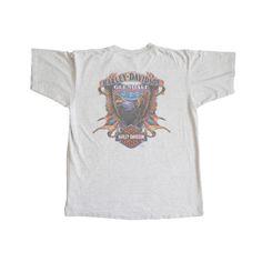 Own a piece of biker history with this Vintage 1996 Harley Davidson Tee. Crafted from soft grey cotton, this tee features a bold, oversized design on the back, showcasing the iconic Harley Davidson spirit. The front is detailed with a small design and a functional pocket, adding a practical touch to the classic look. The authentic vintage wear gives it a rugged, lived-in feel that true enthusiasts will appreciate. Whether you're hitting the road or just want to add some retro flair to your wardrobe, this tee is a must-have for any Harley Davidson fan. One of one 100% Cotton Made in USA  *Authentic vintage may have imperfections*  Machine wash cold inside out Do not bleach Do not tumble dry Iron low Diamond Huggie Earrings, Harley Davidson Tee, September Birthstone Jewelry, Small Design, August Birthstone Jewelry, July Birthstone Jewelry, Harley Davidson Shirt, Gifts For New Mums, Vintage Harley Davidson