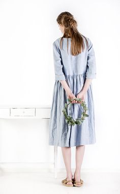 "Handcrafted Oeko-Tex Standard certified 100% European linen smock dress ideal for everyday wear. Perfect for springtime or chilly summer days. Always dress to kill! Neckline: round Silhouette: low waist Hem length: ±45\"/115cm (we can make adjustments) Sleeve lenght: 3/4 Pockets: side seam Details: *Colour shown: navy blue/ charcoal grey/ ice blue *Model is wearing size M *Medium weight *Maternity-friendly *Relaxed fit *Not-ironed (and no need to) *Handmade by @LinenCloud Easy care: - Machine w Spring Flax Linen Dress, Spring Linen Dress With Slip Pockets For Daywear, Spring Smock Midi Dress With Relaxed Fit, Spring Midi Dress With Smock And Relaxed Fit, Spring Linen Midi Dress With Pockets, Spring Linen Day Dress With Pockets, Spring Daywear Linen Dress With Pockets, Spring Linen Dress With Pockets, Spring Linen Dress With Pockets And Relaxed Fit