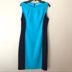 Absolutely Gorgeous Dress In Perfect Condition Navy/Turquoise Back Zip, Fully Lined Has A Little Bit Of Stretch To The Fabric, It’s Very Comfortable 34” In Length Laid Flat It Measures 17” Armpit To Armpit, 16” At Waist And 20” At Hips. Smoke Free Home Blue Color Block Dress For Work, Fitted Blue Color Block Dress, Tahari Dress, Gorgeous Dresses, Shift Dress, Color Blocking, Colorful Dresses, Size 2, Turquoise