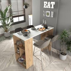 a kitchen table with two chairs next to it and a potted plant in the corner