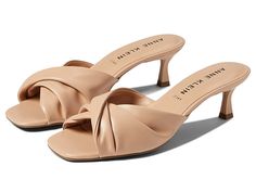 Anne Klein Lauraly - Women's Shoes : Nude : Let your sophisticated style flourish wearing the Anne Klein Lauraly Heeled Sandals, featuring unique twisted straps and chunky kitten heels. Man-made upper, lining, and insole. Easy slip-on style. Square open toe. Padded footbed. Man-made outsole. Imported. Measurements: Heel Height: 2 1⁄2 in Weight: 7 oz Measurements: Heel Height: 2 1 2 in Weight: 7 oz Product measurements were taken using size 9, width M. Please note that measurements may vary by si Beige Sandals With Deep Heel Cup For Summer, Beige Low Heel Mules For Spring, Spring Beige Low Heel Mules, Synthetic Almond Toe Kitten Heels For Summer, Summer Almond Toe Kitten Heels In Synthetic Material, Summer Synthetic Kitten Heels With Almond Toe, Modern Fitted Sandals With Almond Toe, Chic Synthetic Sandals With Almond Toe, Chic Beige Sandals With Sculpted Heel