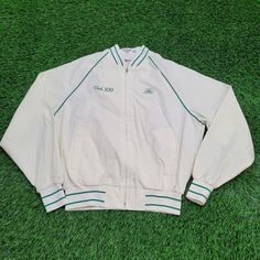 Vintage King-Louie Jacket Large 24x25 White Club-100 USA Elevate your style with this vintage King-Louie white club jacket, USA-made, perfect for retro lovers!  * Used condition  * Length is on the shorter side  * No rips/holes  * No stains  * Normal fading from washing VINTAGE KING-LOUIE JACKET, LARGE VINTAGE JACKET, WHITE CLUB-100 JACKET, KING-LOUIE CLUB JACKET, USA VINTAGE JACKET, KING-LOUIE CLOTHING, CLUB-100 JACKET, RETRO WHITE JACKET, LARGE RETRO JACKET, VINTAGE USA JACKET 67568 Retro Cotton Track Jacket For Spring, Retro White Cotton Track Jacket, Retro White Varsity Jacket For Spring, Classic White Long Sleeve Track Jacket, Vintage White Track Jacket, Retro Cotton Track Jacket With Long Sleeves, Vintage White Cotton Outerwear, White Vintage Cotton Outerwear, White Retro Long Sleeve Outerwear