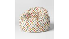 a multicolored bean bag chair sitting on top of a white floor