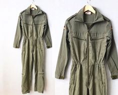 "The shop remains open over the Christmas period but our next posting dates will be after Christmas - 4th & 5th January. Thanks for visiting :) . . . Vintage German Flight Suit / Workwear Overalls / Jumpsuit / Boiler Suit Green Fantastic zip through flying suits from the German Airforce. Softened, comfortable thick 100% cotton fabric. Loads of character. Tough and hard wearing design. Features include: - Various zip pockets: chest, hips, knees - Drawstring adjustable waist - German military Green Cotton Long Sleeve Jumpsuits And Rompers, Military Style Long Sleeve Cotton Jumpsuit, Military Style Long Sleeve Cotton Jumpsuits And Rompers, Green Long Sleeve Cotton Jumpsuits And Rompers, Green Long Sleeve Cotton Jumpsuit, Green Cotton Long Sleeve Jumpsuit, Military Style Long Sleeve Khaki Jumpsuit, Khaki Military Style Long Sleeve Jumpsuits, Khaki Military Long Sleeve Jumpsuit