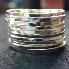 "Sleek yet slightly rustic bohemian, these trendy Sterling Silver stackable rings will be made to order for you as a set of 10 bands. Created entirely by me in my jewelry studio, these awesome skinny rings are completely hand forged, hammered for texture, tumbled and polished to a high shine. Each ring is approximately 1mm wide, so 10 worn together measure about 10mm wide. {LISTING FEATURES} ~ Sterling silver ring ~ Very skinny rings ~ Stackable with each other ~ Shiny silver finish ~ Hammered t Rings Stacking, Ring Sets Boho, Multiple Rings, Stackable Rings Silver, Rings Sterling Silver, Sterling Silver Stacking Rings, Stacking Ring Set, Hammered Rings, Silver Stacking Rings